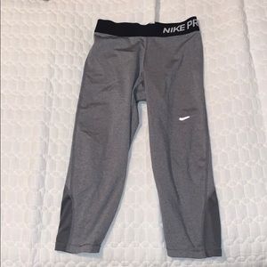 Grey Nike knee high leggings.